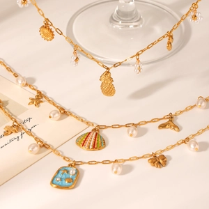 Gold stainless steel ocean necklace set with pearl, starfish, and enamel charms