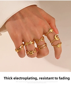 Close-up of set of 8 gold plated rings with moon and star motifs on a hand