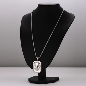 Hip hop stainless steel necklace with square lion head relief pendant on a mannequin