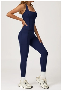 Close-up of deep blue yoga set showing high waist leggings with side pocket detail