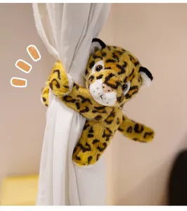 Plush leopard animal curtain tieback wrapped around a white curtain fabric