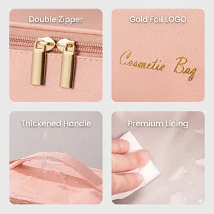 Pink cross-grain leather makeup bag with gold zipper and waterproof lining