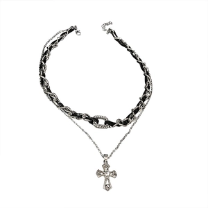 Double-layered necklace with black leather weave and sparkling rhinestone cross pendant