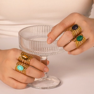 Bohemian gold plated stainless steel layered rings set with natural stones on model