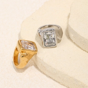 Detailed macro view of gold and silver plated rings with rectangular cubic zirconia