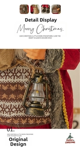 Detail of Santa Claus figurine with gold lantern and textured Nordic knit sweater