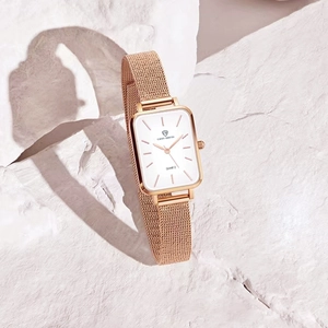 Elegant vintage gold square quartz watch for women with metal mesh strap on white stone