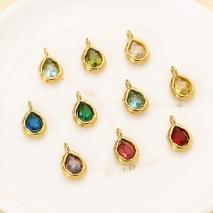 Detail of colorful teardrop rhinestones with gold plating for DIY jewelry making
