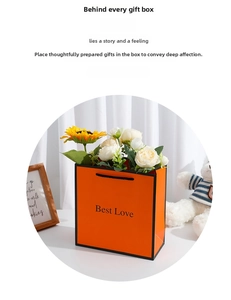 Orange Best Love gift bag with sunflowers and roses in a cozy home setting macro