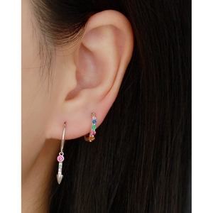 Close-up of S925 sterling silver hoop earrings with colorful zircon stones on model