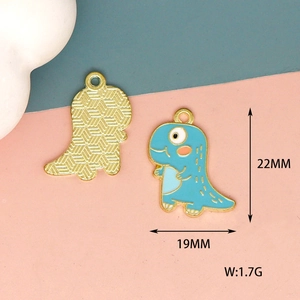 Detailed view of blue dinosaur charm with 22mm size and texture on gold metal back