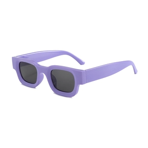 Retro square purple sunglasses with wide frames and dark lenses shown from a side front angle
