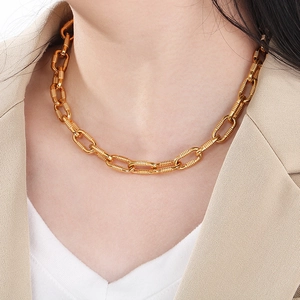Close-up of 10mm chunky 18K gold plated stainless steel O-chain necklace on a model