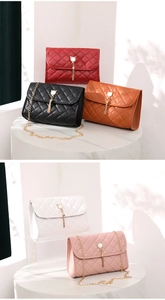 Detail of quilted leather texture with golden cat-shaped buckle and elegant fringe tassel