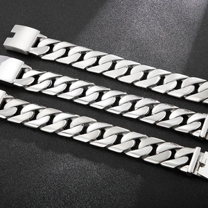 Detailed view of silver stainless steel Cuban link bracelet with brushed metal clasp