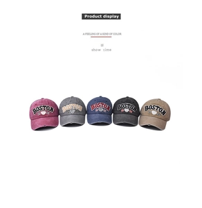 Front view of five distressed Boston baseball caps in various colors with vintage embroidery