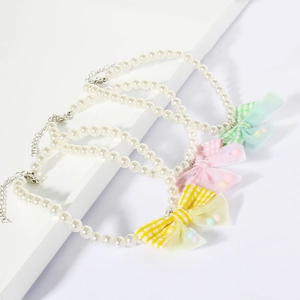Elegant pet pearl necklace set with colorful plaid bows in yellow, pink and green