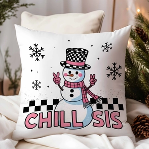 Close-up of a white Christmas pillow cover with a snowman and CHILL SIS slogan decoration