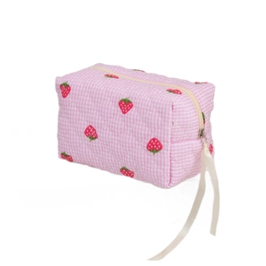 Quilted floral makeup bag with pink checkers and strawberry print, featuring ribbon zipper