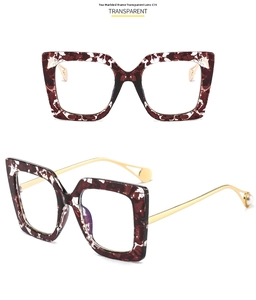 Detail of tortoise floral square frame sunglasses with gold metal temples and pearl tips