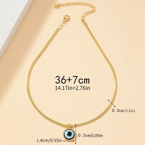 Detailed view of evil eye pendant with 36+7cm gold snake chain measurements