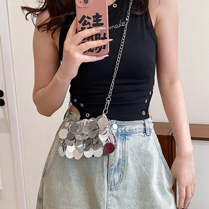 Silver sequin mini crossbody bag with metal chain strap shown in a lifestyle mirror selfie