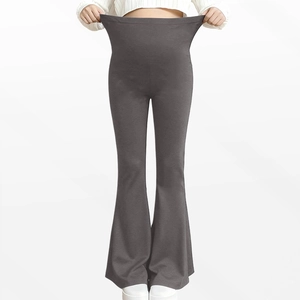 Close-up showing the high elasticity of the dark grey maternity yoga leggings