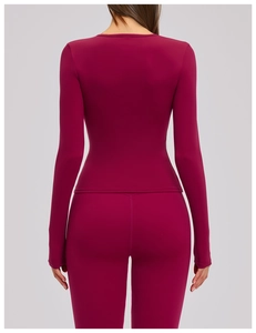 Rear view of a slim-fit dark magenta yoga set with long-sleeve top and high-elastic leggings