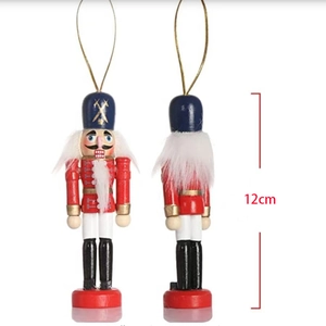 Detail of 12cm painted wooden Nutcracker soldier ornament with red and blue accents