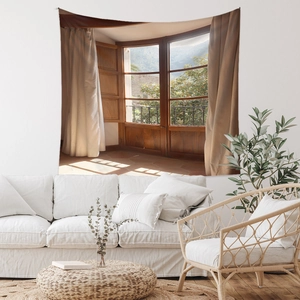 Detail showing a boho window landscape tapestry hanging in a minimalist living room decor