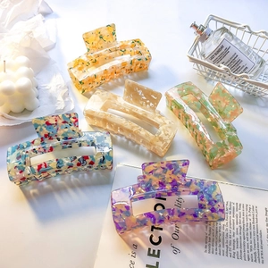 Set of five large acetate checkered hair claws in vibrant floral and solid patterns