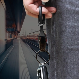Durable black titanium car keychain with flexible strap and premium metal ring holder