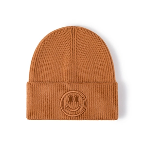 Caramel brown ribbed knit beanie featuring a minimalist embroidered smiley face