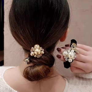 French vintage pearl rhinestone hair scrunchie shown in a ponytail and hand view