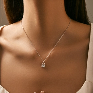 S925 silver necklace with square lock pendant and sparkling Moissanite on a model