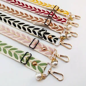 Bohemian embroidered phone strap with leaf pattern, gold hooks and pearl pendant