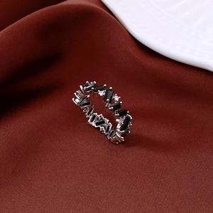 Macro view of silver vintage ring with black rectangular zircons and clear small stones