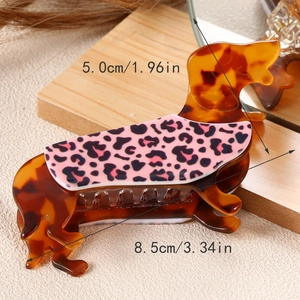 Detail view of dachshund hair claw clip with dimensions 8.5cm by 5.0cm on light background
