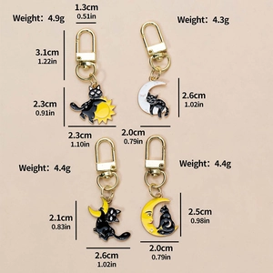 Set of four punk black cat keychains featuring moon and sun enamel metal pendants