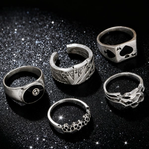 Detail of five-piece gothic ring set with billiard 8-ball and spade poker motifs