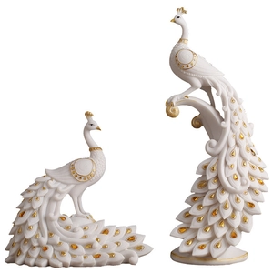Elegant white peacock figurines set with gold trim for home and office decor