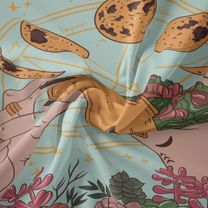 Detail of celestial fabric showing Taurus and Virgo zodiac prints on light blue cloth