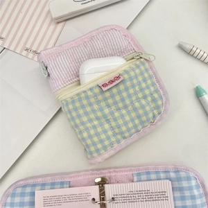 Quilted fabric organizer case with yellow blue plaid and pink stripe lining for AirPods