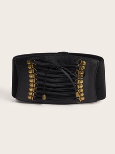 Detail view of black wide corset belt with gold eyelets and lace-up drawstring front