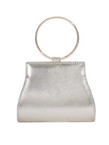 Silver textured evening clutch bag with golden circular metal handle on white background