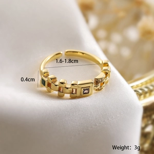 Detail showing ring dimensions 1.6-1.8cm and purple green zircon inlays on gold band