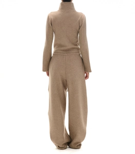 Rear view of brown long sleeve half-zip sweatshirt and wide-leg trousers set on white background