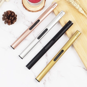 Electric arc lighters in rose gold, silver, black, and gold on a marble surface