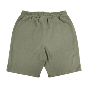 Rear view showing the elastic waistband and texture of these olive green linen shorts