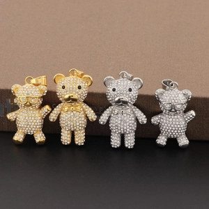 Close-up of hip hop teddy bear pendants in gold and silver finish with sparkling rhinestones